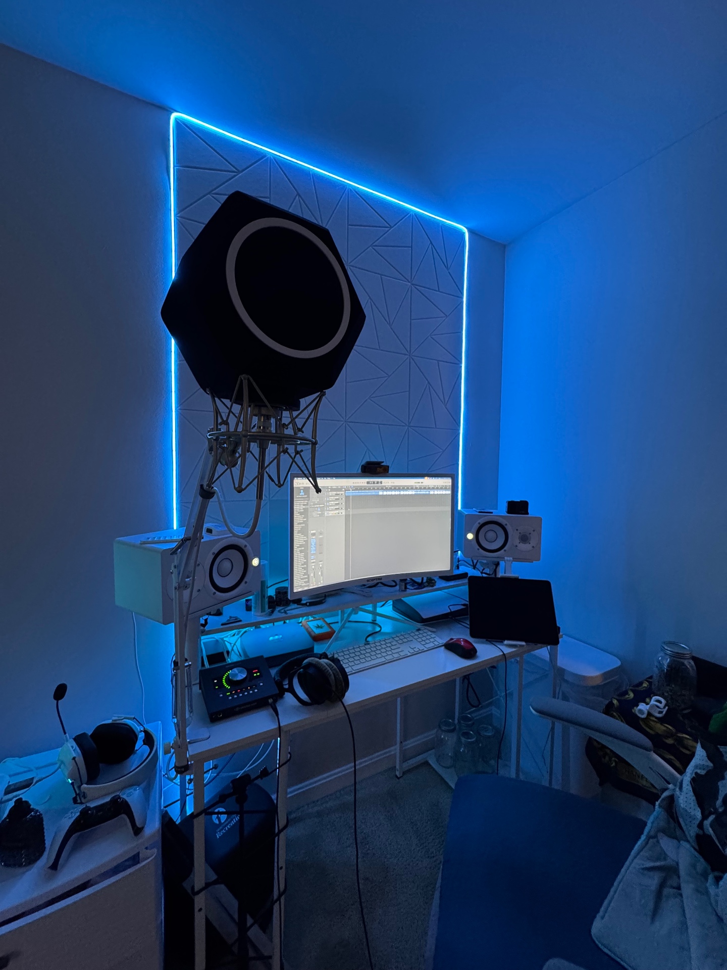 Professional recording studio with mixing console and monitors
